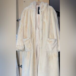 A long beige faux fur military coat for those really windy and cold days.